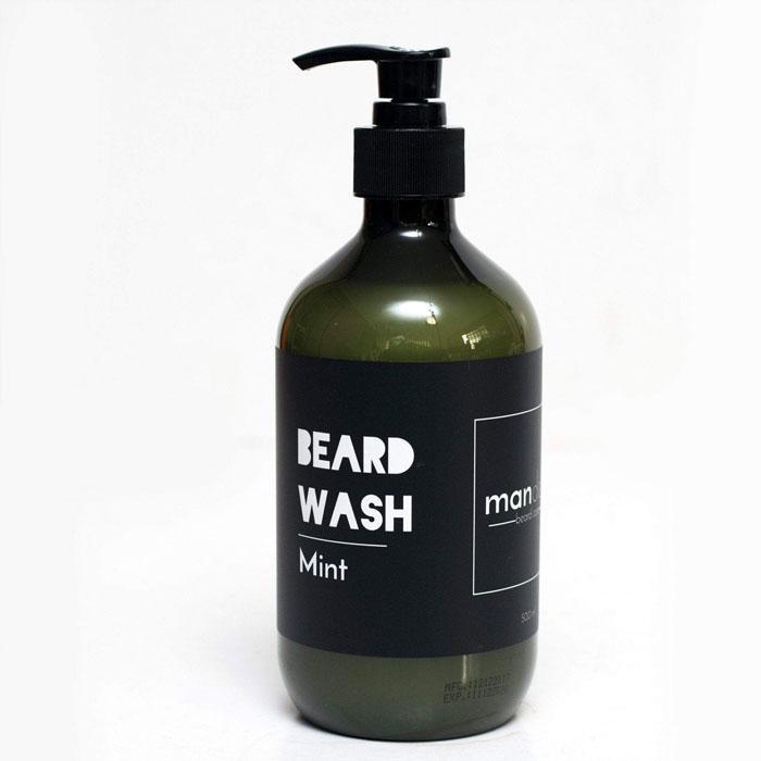 A green bottle of Mandevu Mint Beard Wash with a pump dispenser, labeled for beard care.